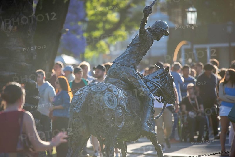 Metal sculpture of a polo player on the grounds of the polo stadium with many visitors, Buenos Aires, Argentina