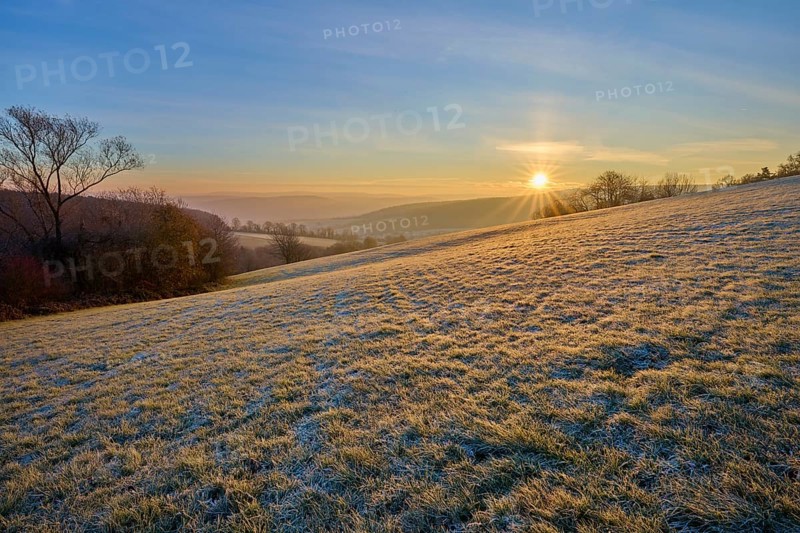 A sunny, frosty morning with a view of a hilly landscape, Seckmauern, Lützelbach, Maintal, Odenwald, Hesse, Germany