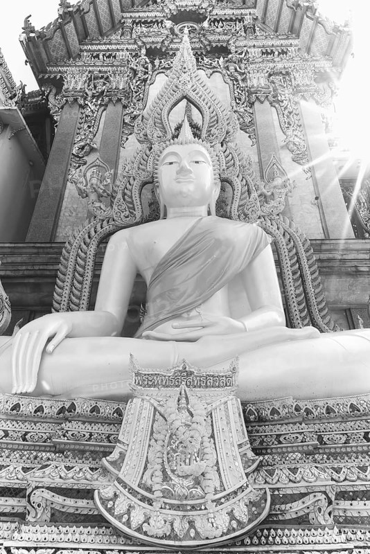 Buddha statue with tunic, Bhumispara mudra, Buddha Gautama at the moment of enlightenment, at the entrance to Wat Sitthawararam, Bangkok, Thailand