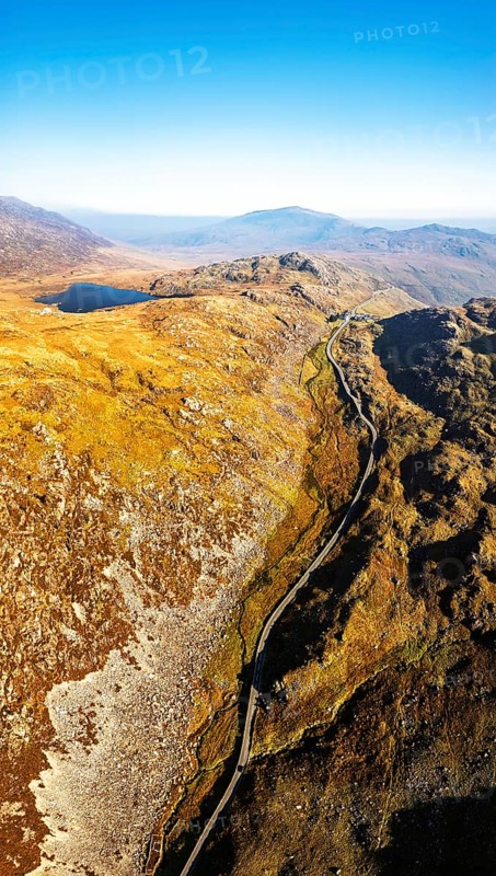 Autumn colours over Llyn Cwmffynnon and Miner's Track, Start Point, road A4086 from a drone, Pen-y-Pass, Snowdonia, Wales, UK