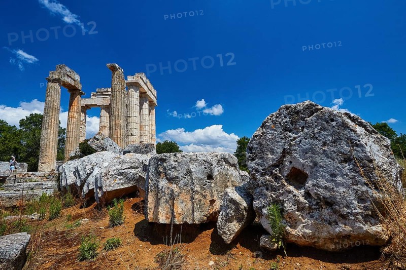 Large stones and ancient pillar remains under bright blue sky, Nemea, Ancient Zeus Heightum, Archaeological Site, Peloponnese, Greece