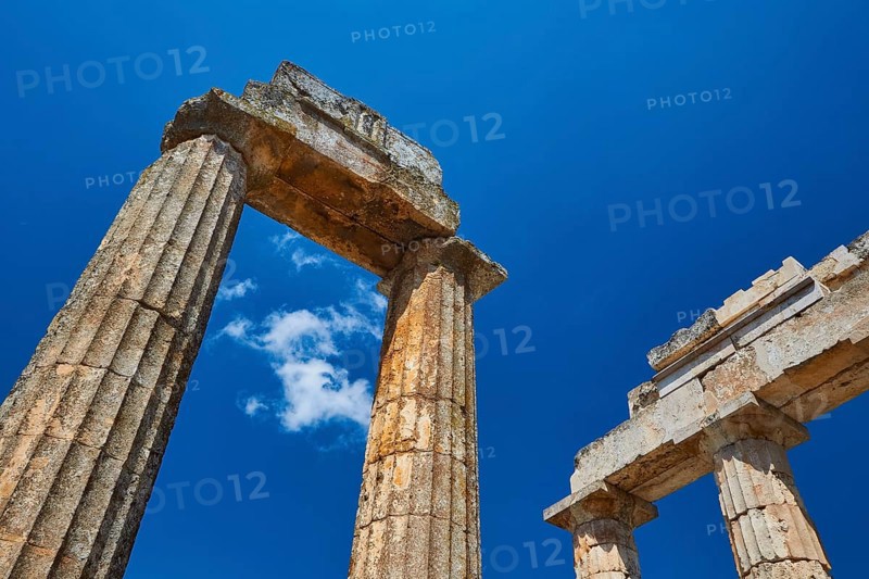 Ancient columns rising into the clear sky, Nemea, Ancient Zeus Church, Archaeological Site, Peloponnese, Greece