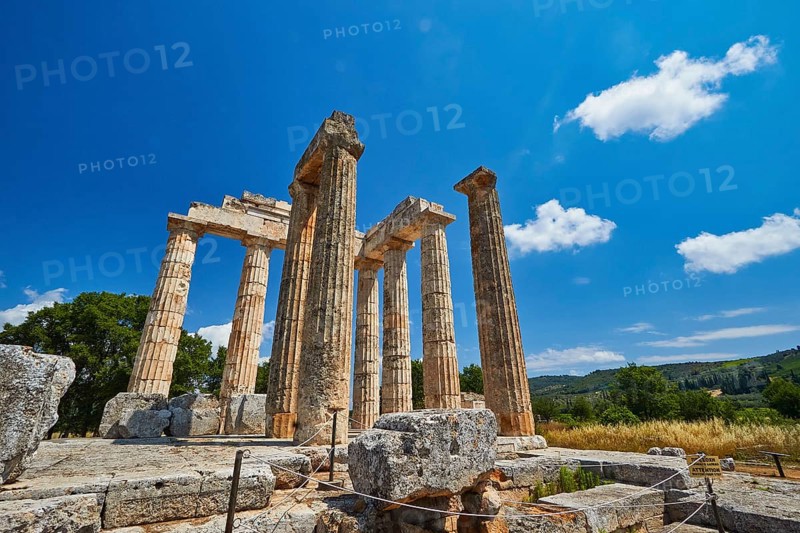 Ancient columns in a vast landscape under clear sky, Nemea, Ancient Zeus Heightum, Archaeological Site, Peloponnese, Greece
