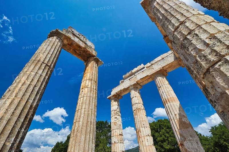 View of ancient columns and ruins with clear skies, Nemea, Ancient Zeus Heightum, Archaeological Site, Peloponnese, Greece
