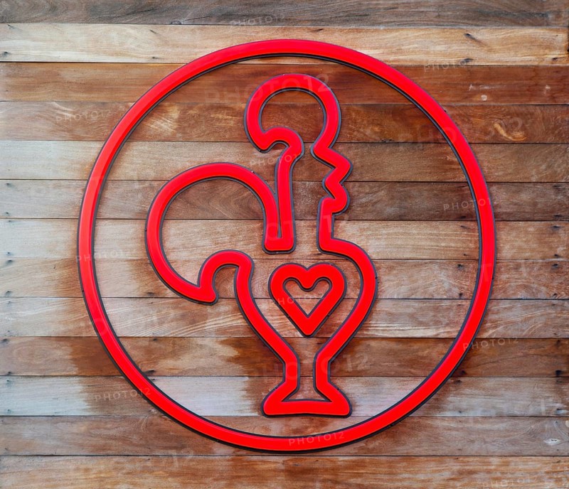 Nando's fast-food restauarnt logo symbol red cockerel heart, Exeter, Devon, England, Uk
