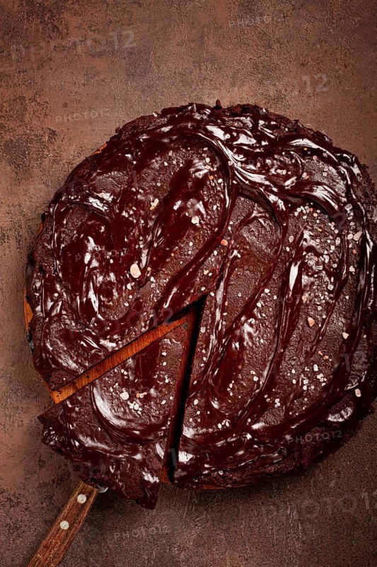 Chocolate cake, round cake, on a brown background, top view, homemade cakes, no people