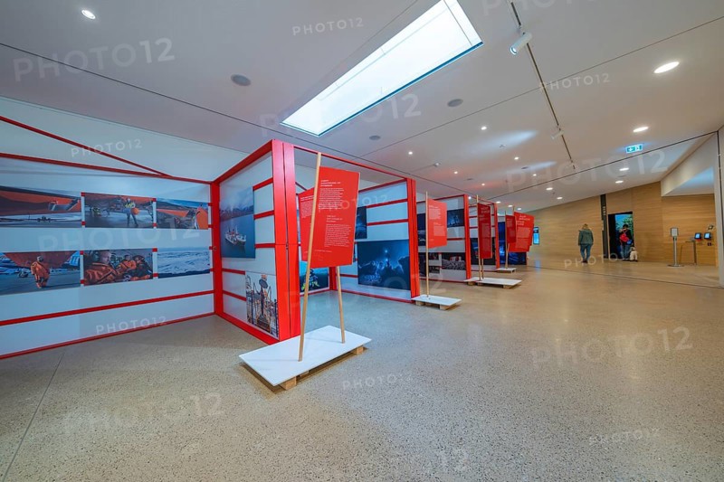 Modern exhibition room with red information stands and bright lighting in a minimalistic design, Ruhestein National Park Center, Black Forest, Baiersbronn, Germany