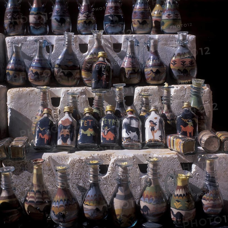 Souvenir stand, bottles filled with colorful sand, Nabataean rock town Petra, Jordan
