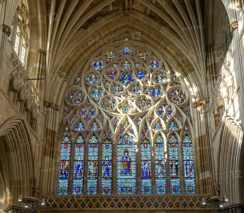 Stained glass of the west window inside Exeter cathedral church, Exeter, Devon, England, UK