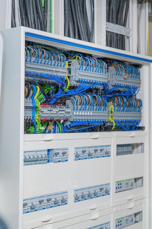 Detailed cable system in the control box with blue and black cables