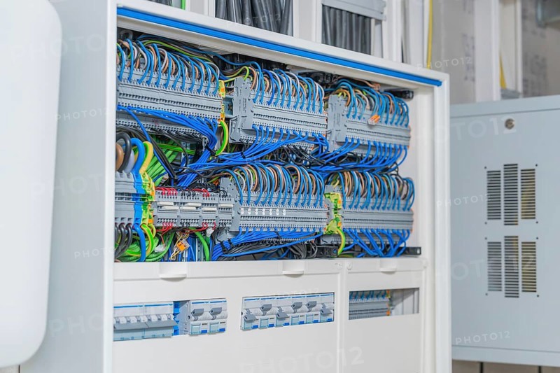 Cable management system with lots of colorful cables in a control box