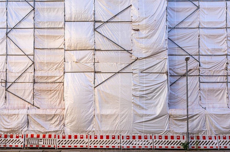 White construction plans cover the entire construction site of a building, Ziegelstraße, Berlin, Germany