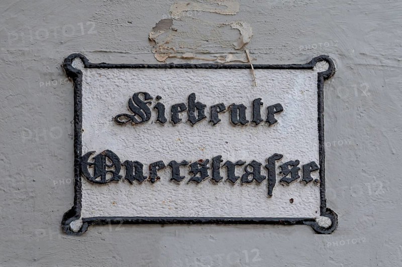 Seventh Cross Road, a historic street sign in the old town, Hanseatic City of Lübeck, Schleswig-Holstein, Germany