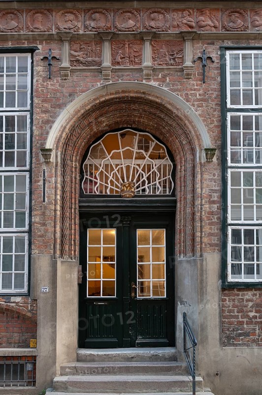 Entrance of a historic residential building with terracotta decoration, built around 1560, Mengstraße 27, Hanseatic City of Lübeck, Schleswig-Holstein, Germany