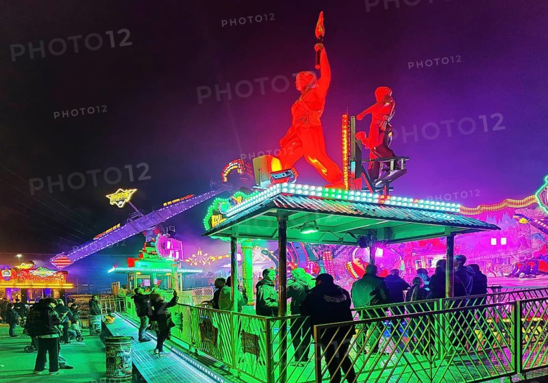 Colourfully illuminated All Saints Fair at night, the largest old town fair in Europe, Soest, North Rhine-Westphalia, Germany
