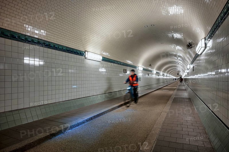 Interior view, pedestrians and cyclists crossing tunnel, mopping effect, movement, tube, historic old Elbe Tunnel, Free and Hanseatic City of Hamburg, Germany
