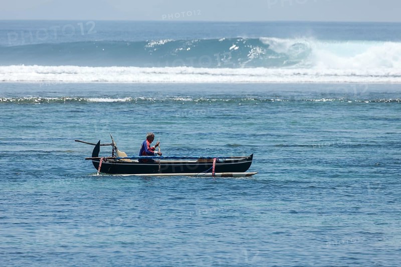Fishing outrigger boat off Sanur beach, Bali, Indonesia