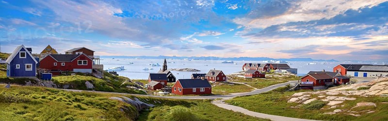 Typical architecture of Greenland Ilulissat with colored houses located near fjords and icebergs