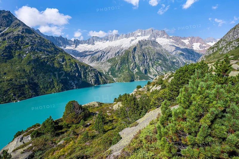 Turquoise blue mountain lake Göscheneralpsee, picturesque mountain landscape with dammastock and damma glacier, Göscheneralp, Canton of Uri, Switzerland