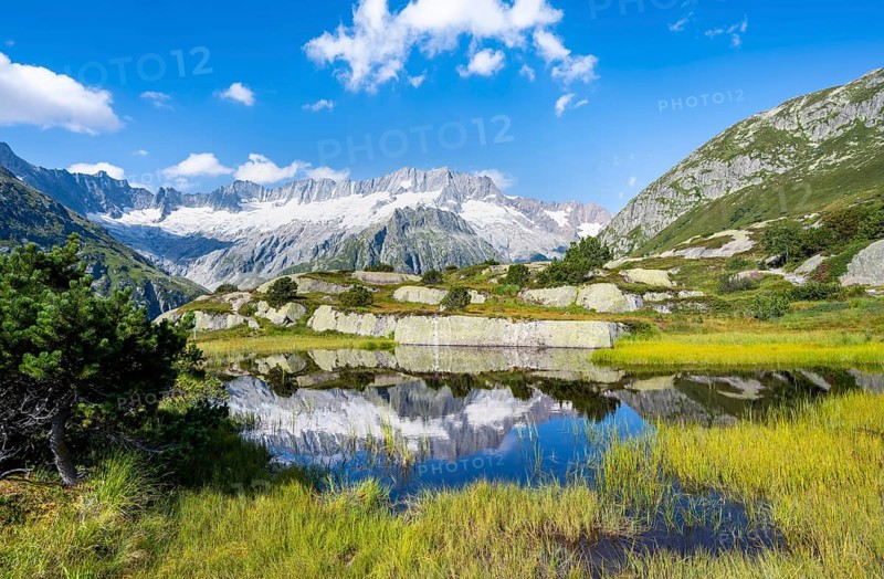 Picturesque mountain landscape, dammastock and damma glaciers reflected in Moorsee, Göscheneralp, Canton of Uri, Switzerland