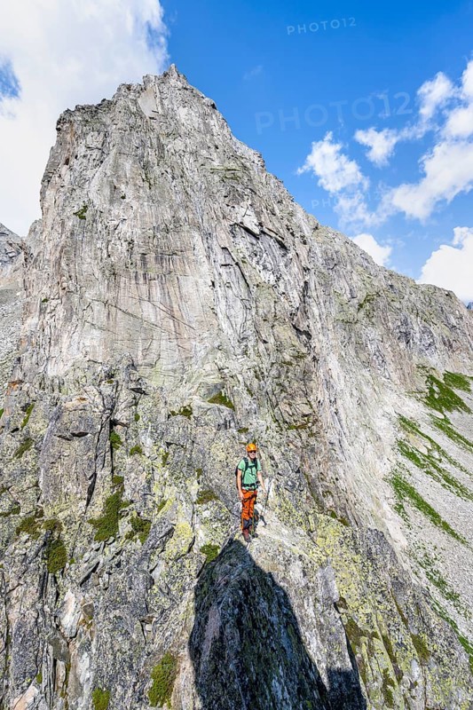 Mountaineers on the secure via ferrata Crocodile Mountain Lake at Bergseeschijen-Vorbau, Göscheneralp, Canton of Uri, Switzerland