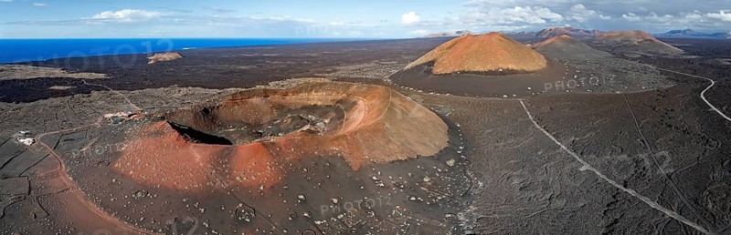Montaña Quemada and Montaña Pedro Perico volcanoes, volcanic landscape with craters and lava fields, aerial view, Lanzarote, Canary Islands, Spain