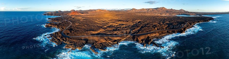 Coast with lava fields, volcanic landscape near Los Hervideros with red volcano Montaña Bermeja, in the evening light, aerial view, Lanzarote, Canary Islands, Spain