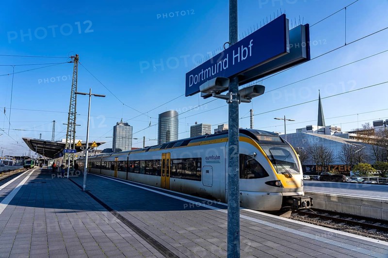 The skyline of the city center of Dortmund as seen from the main train station, Eurobahn train, North Rhine-Westphalia, Germany