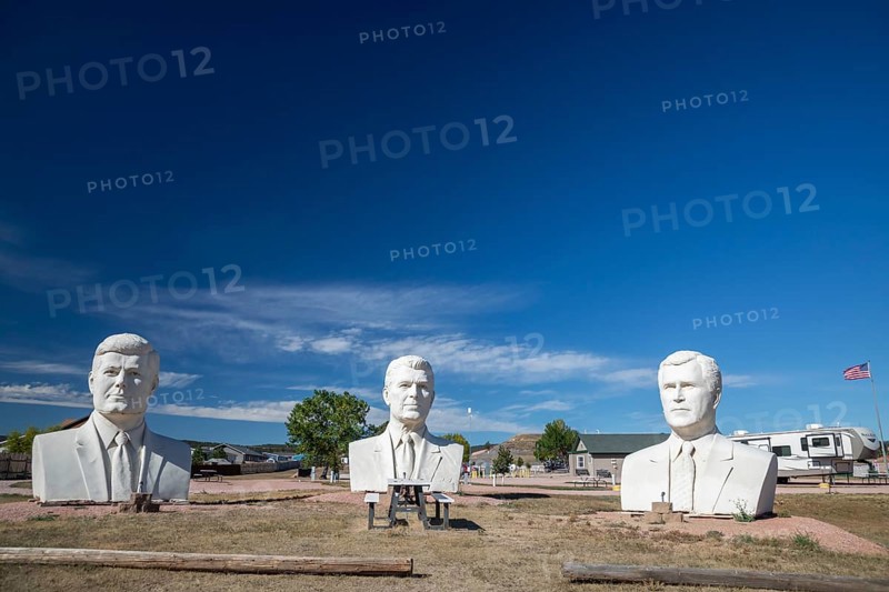 Hermosa, South Dakota - The 20-foot-tall heads of Presidents John Kennedy, Ronald Reagan, and George W. Bush, crafted by artist David Adickes outside an RV park. These were three of 43 Presidential heads made for Presidents Park, near Mt. Rushmore. Presidents Park went out of business a few years after opening in 2003