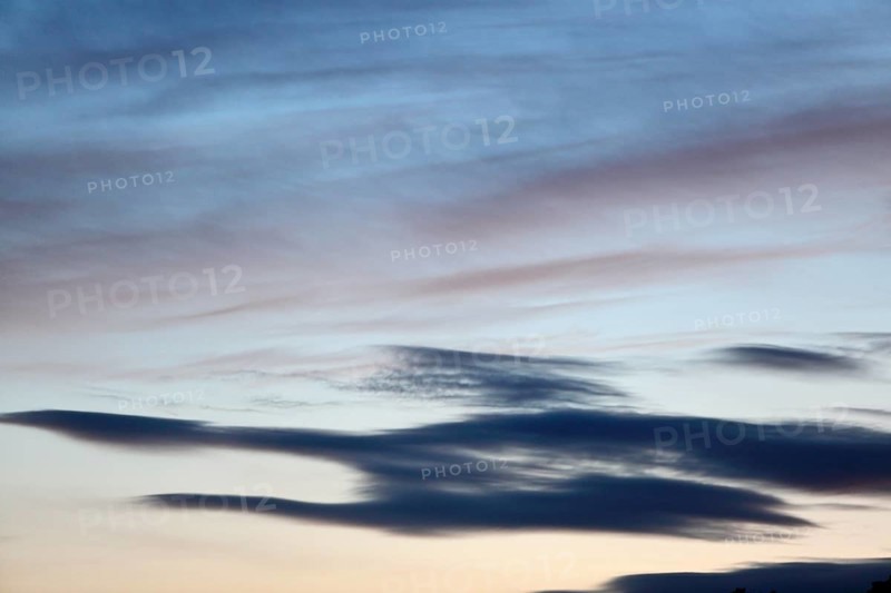 Pastel-coloured cloud formations in the evening sky, Peenetal nature park Park, Mecklenburg-Western Pomerania, Germany