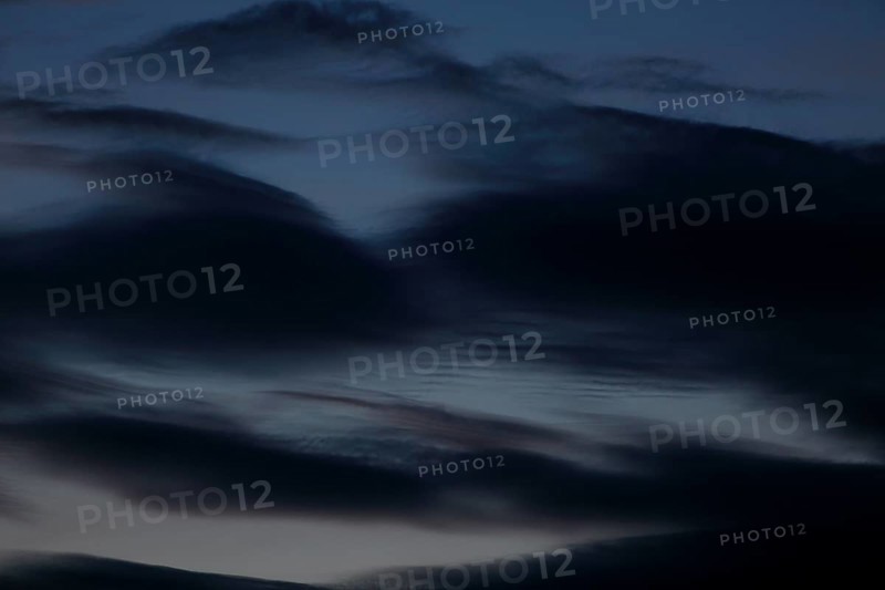 Dark clouds sweep across the sky at dusk, Peenetal nature park Park, Mecklenburg-Western Pomerania, Germany