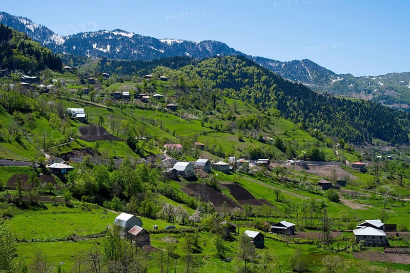 Rural settlement with scattered houses in a green mountain landscape, on the way to the Goderdzi Pass near Riketi, Ajara region, Ajara, autonomous republic, Georgia