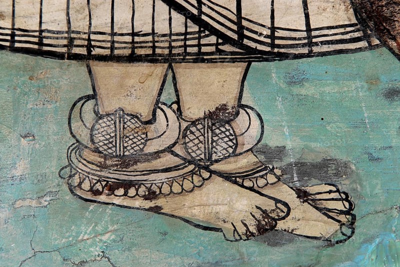 Feet with large traditional silver foot decoration, frescoes, Devigarh Palace Hotel, near Udaipur, Rajasthan, India