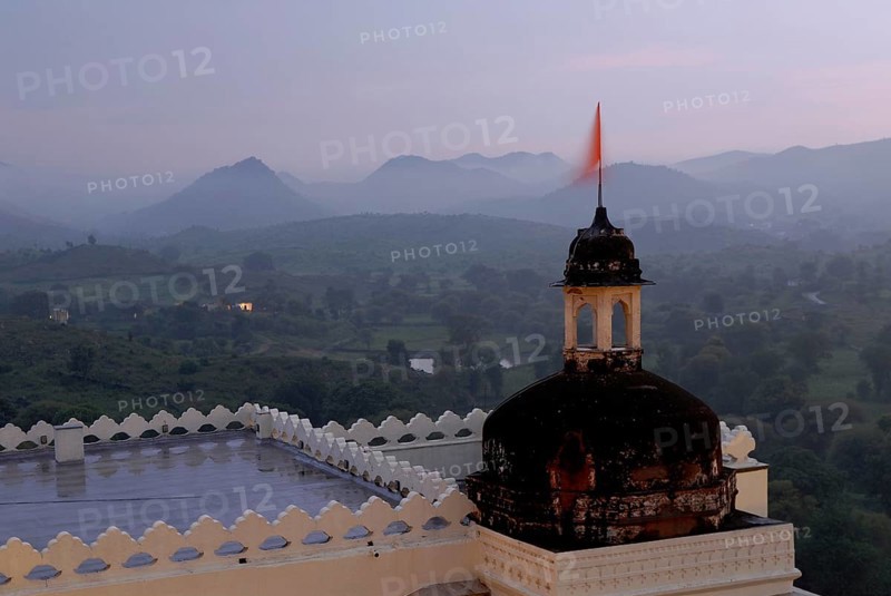 Hilly landscape of Aravalli Mountains in soft twilight, monsoon atmosphere, Devigarh Palace Hotel, Delwara village near Udaipur, Rajasthan, India