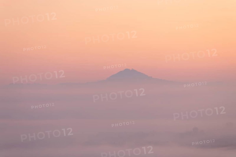 Hohenstaufen mountain in golden morning light, Aichelberg. Spectacular dawn over the foggy foothills of Alb