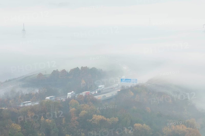 Aichelberg Alb climb of the A8 in thick fog on an autumn morning. Lkr. Göppingen, Baden-Württemberg, Germany
