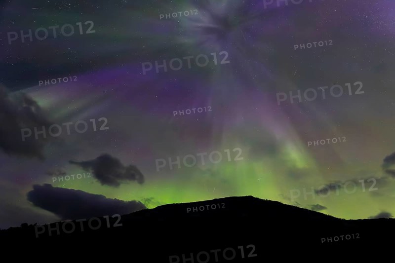 Northern lights at dawn at Sørfolda Fjord near Kjerringøy between Bodø and Sørfold in Norway