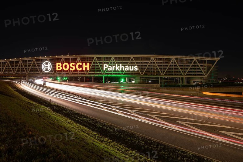 Night view of the A8 with traces of light at the P20 Messe car park, Airport, Stuttgart Germany