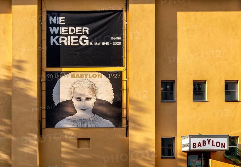 Film posters at the cult cinema Babylon on Rosa Luxemburg Platz, arthouse cinema opened in 1929, some of whose films are accompanied by a live orchestra, Berlin, Germany