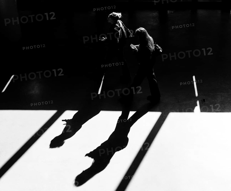 Black and white photograph, foyer in a building at the Technical University of Berlin, light and shadow of people at the Marchstraße exit, Berlin, Germany