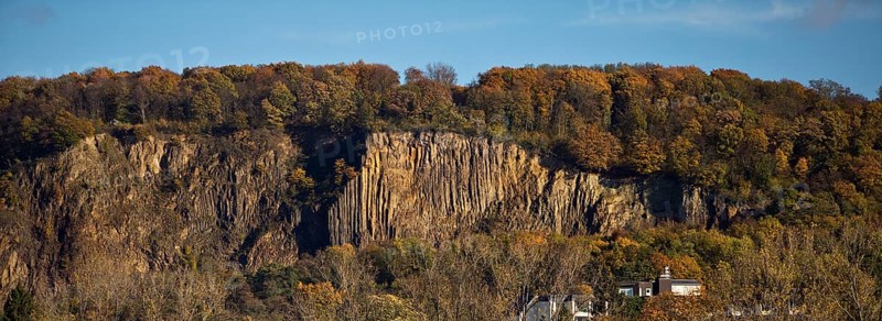 Rock wall with exposed basalt layers from the quarry, Kuckstein am Berg Ennert, Oberkassel, Bonn, North Rhine-Westphalia, Germany