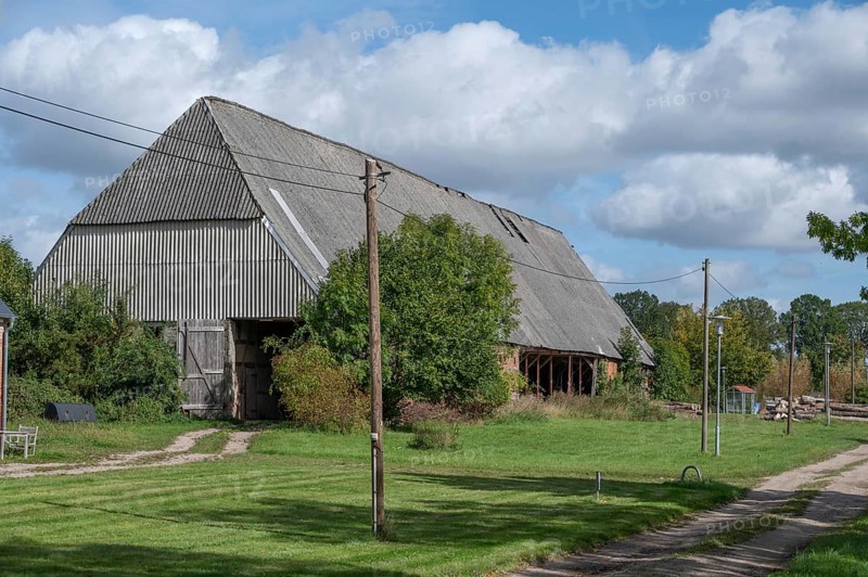 Old barn from 1921, formerly thatched, covered with asbestos panels in GDR times 1970s, Othenstorf, Mecklenburg-Western Pomerania, Germany