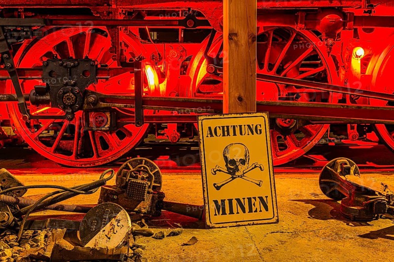 Illuminated wheelwork of a historic locomotive, replica of a mine warning, railway museum, Augsburg railway park, administrative district of Swabia, Bavaria, Germany