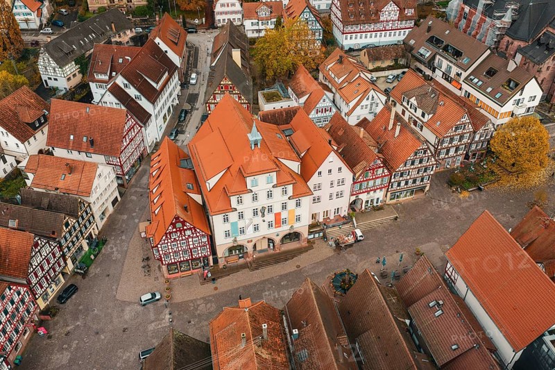 Historic old town with square and surrounding half-timbered houses, lively with pedestrians, Calw, Black Forest, Germany