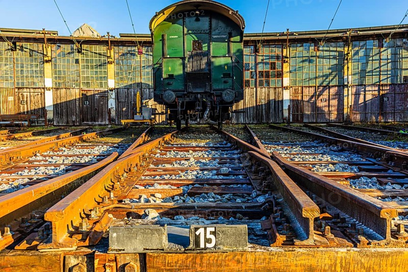 Historic railroad car parked in front of the old engine shed, Augsburg railway park, administrative district of Swabia, Bavaria, Germany
