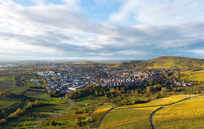 Panoramic view of a village with surrounding vineyards and hills under cloudy sky, autumn, Korb-Steinreinach im Remstal, Baden-Württemberg, Germany