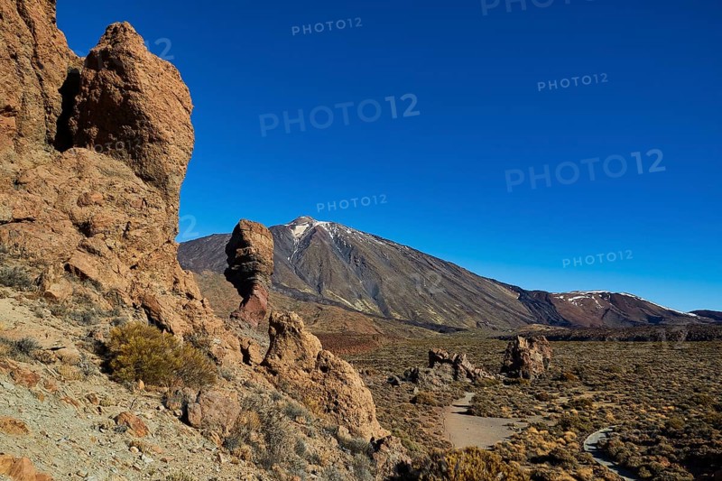 Rocky desert landscape with distinctive rocks and a mountain in the background under clear blue sky, UNESCO World Heritage Site, Teide National Park, Teide National Park, Tenerife, Canary Islands, Spain