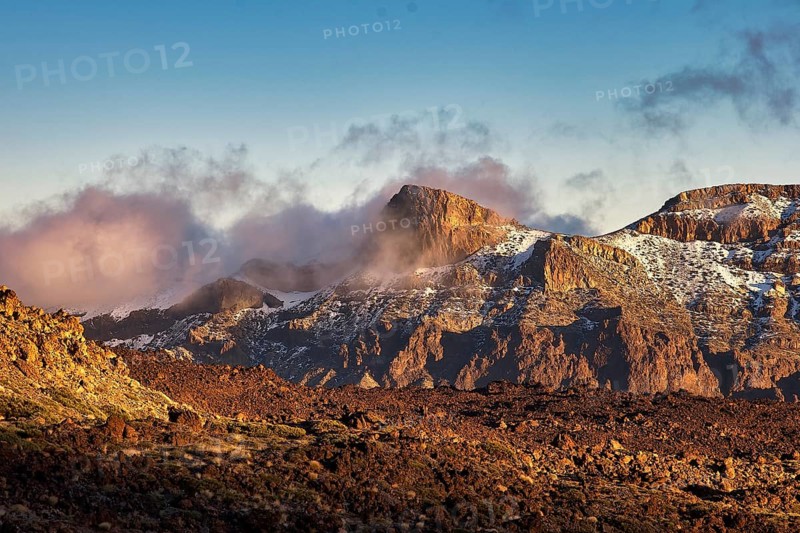 Steep mountains in the evening light with fog and clouds that create a mystical atmosphere, UNESCO World Heritage Site, Teide National Park, Tenerife, Canary Islands, Spain
