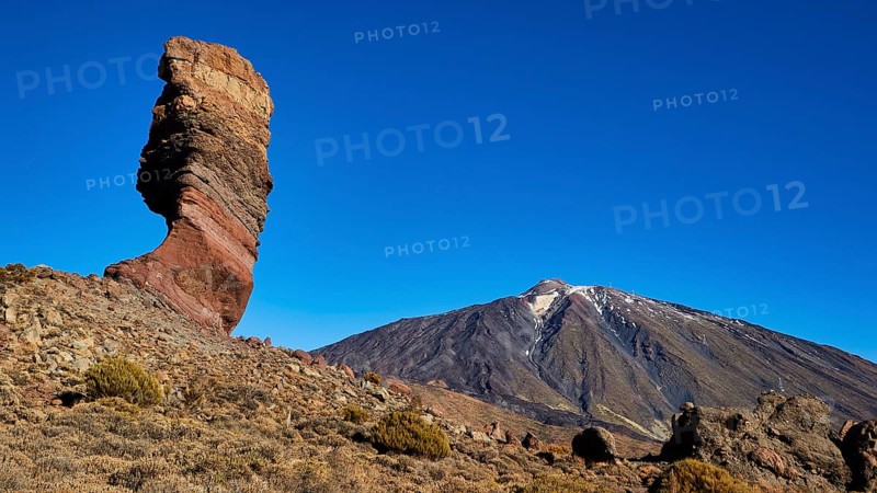 Distinctive rocky outcrop in front of volcano in barren surroundings, UNESCO World Heritage Site, Teide National Park, Tenerife, Canary Islands, Spain