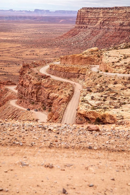 Mexican Hat, Utah - The Moki Dugway, an unpaved road with tight curves and no guardrails which descends 1200 feet from Cedar Mesa. The road was built in the 1950s to transport uranium ore from the mine to a mill
